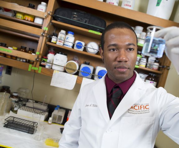 Pharmacy student conducting sample tests.